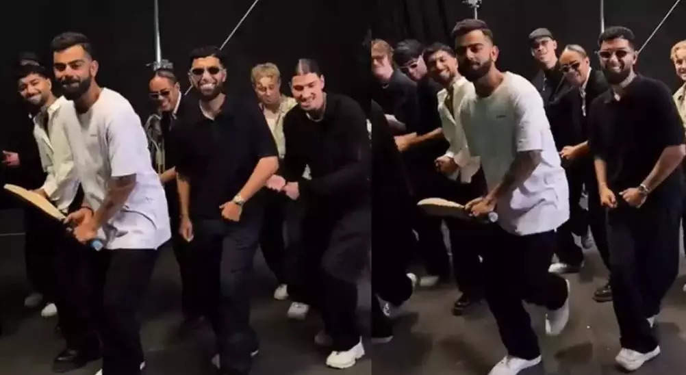 virat kohli dance, Video: હાથમાં બેટ પકડી નોર્વેના ક્વિક સ્ટાઈલ ડાન્સ ગ્રુપ સાથે વિરાટ કોહલીએ લગાવ્યા ઠુમકા - virat kohli shakes his leg with norwegian dance group quick style